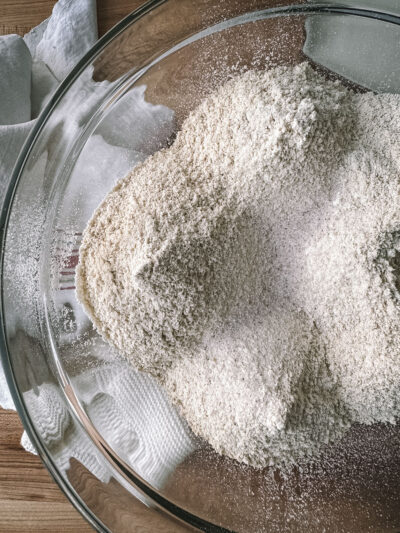 flour and salt of making whole wheat einkorn sourdough flatbread with black seeds