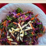 healthy kale salad with cabbage, ginger, and almonds