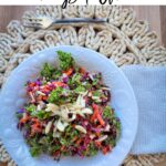 Cabbage and Kale Crunch Salad with fork and napkin on a placemat