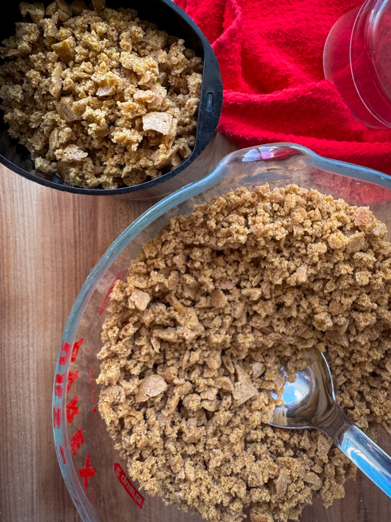 breadcrumbs in a bowl and in a coffee grinder
