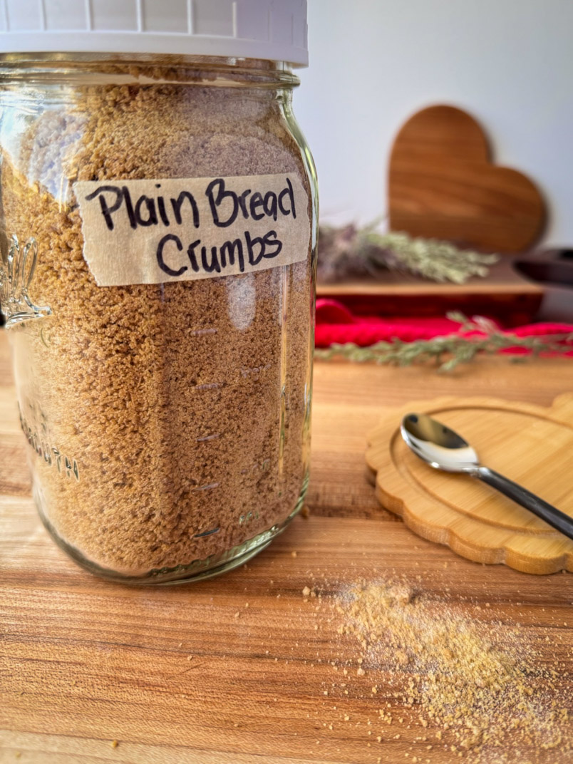 Whole wheat einkorn sourdough breadcrumbs in a jar with a label