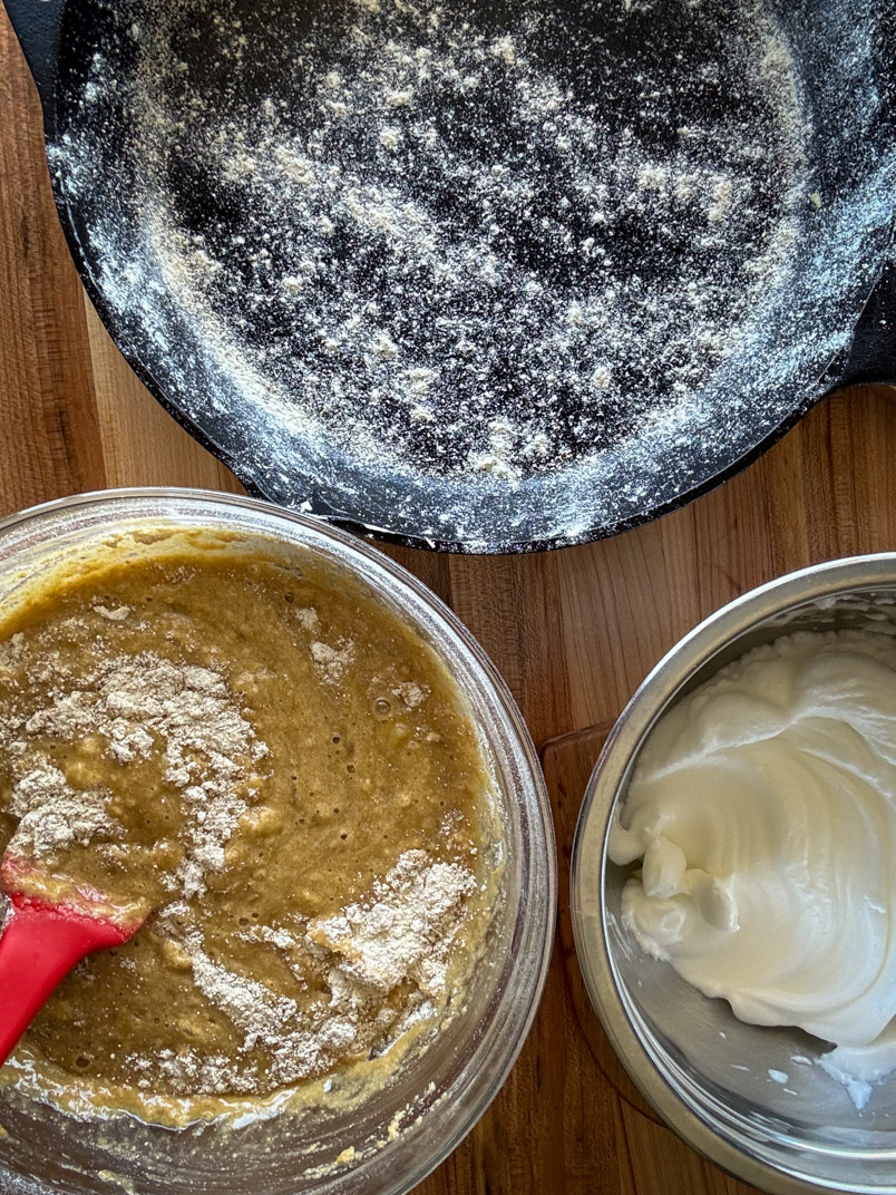 cast iron buttered and floured pan prepped for oil oil cake