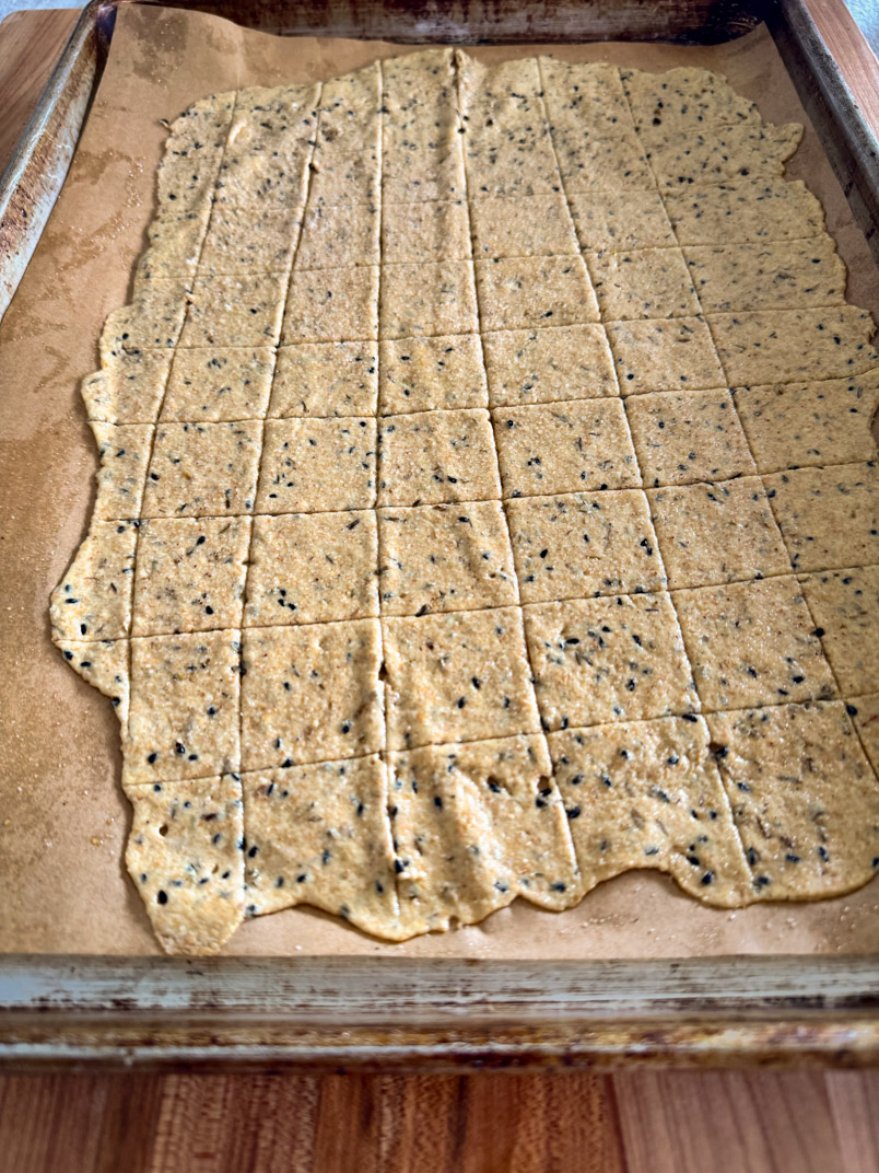 sourdough cracker dough on a sheet pan