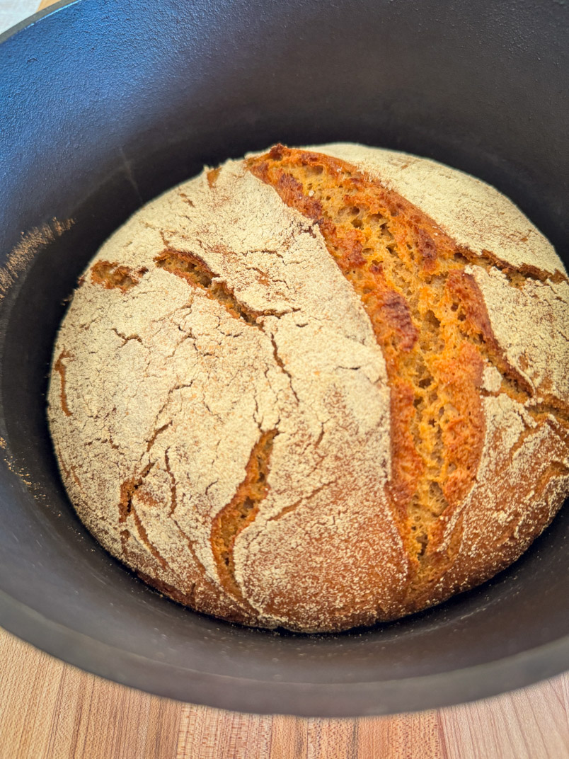einkorn loaf baked in a cast iron Dutch oven