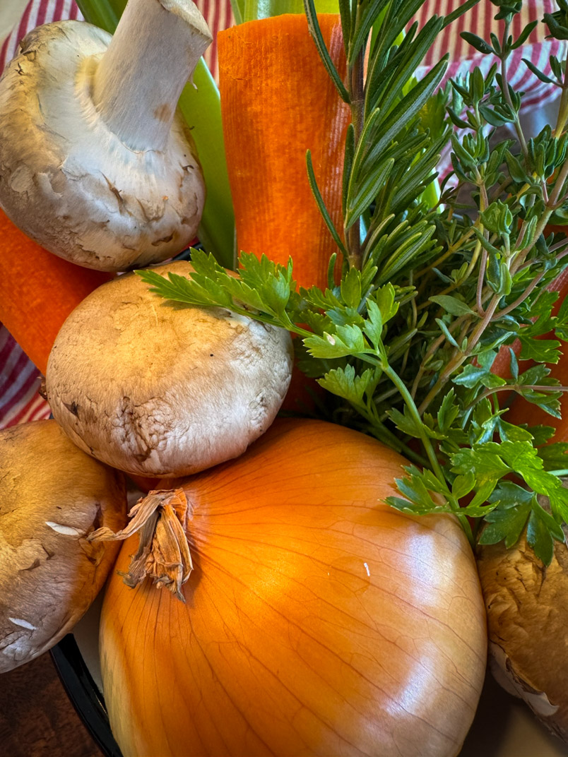 Make Homemade Chicken Broth from Thighs and Drumsticks, carrots, mushrooms, onion, and parsley.