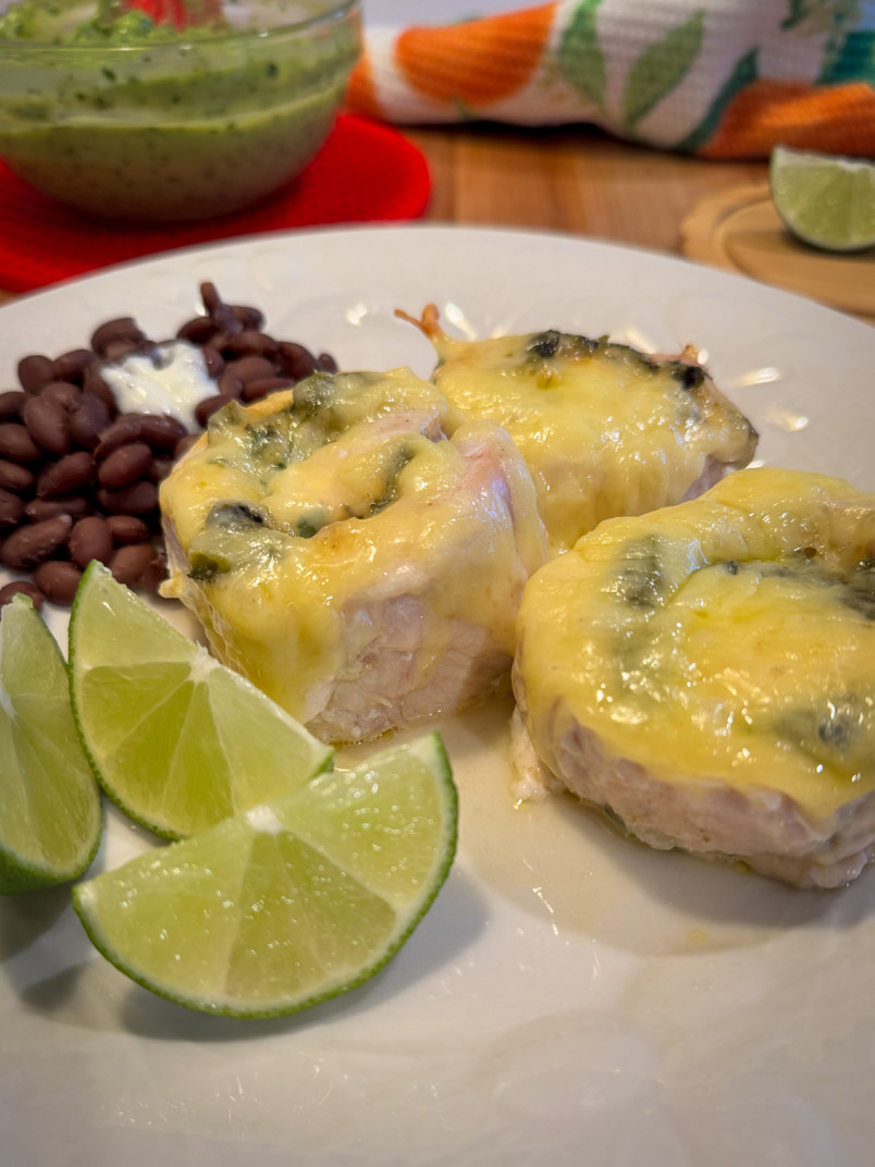 roasted poblano chicken dinner with black beans and lime wedges roasted poblano chicken dinner with black beans and lime wedges