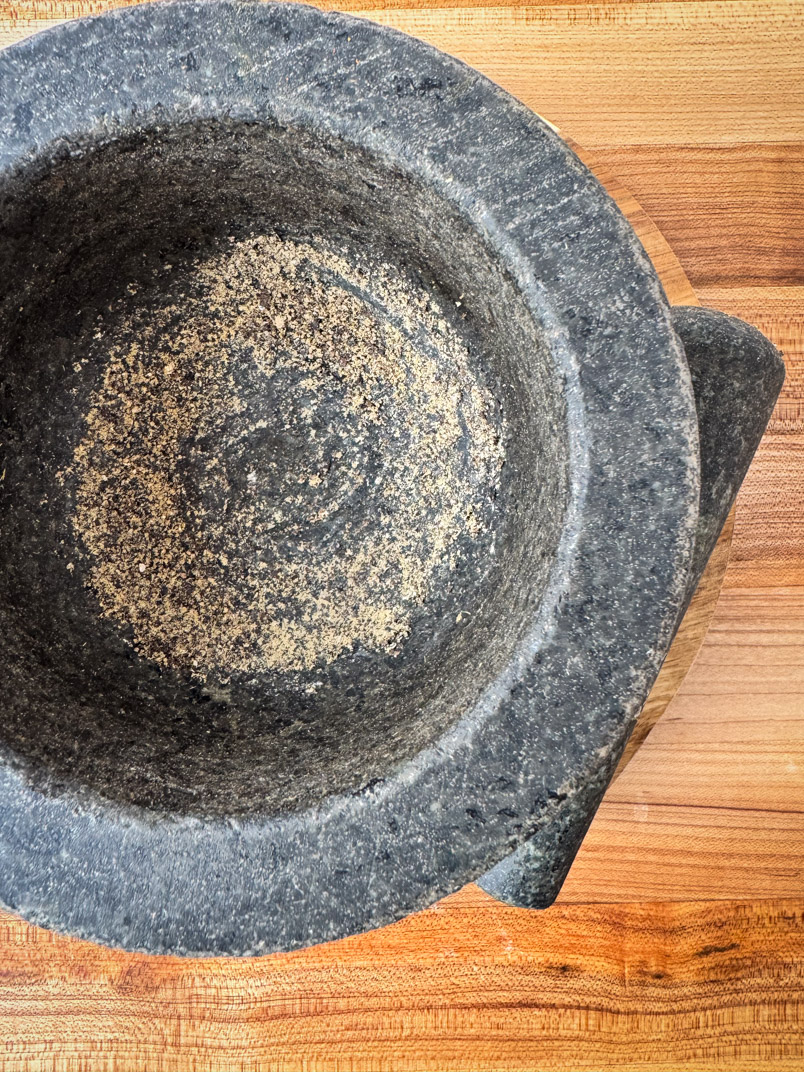 black pepper in a mortar and pestle