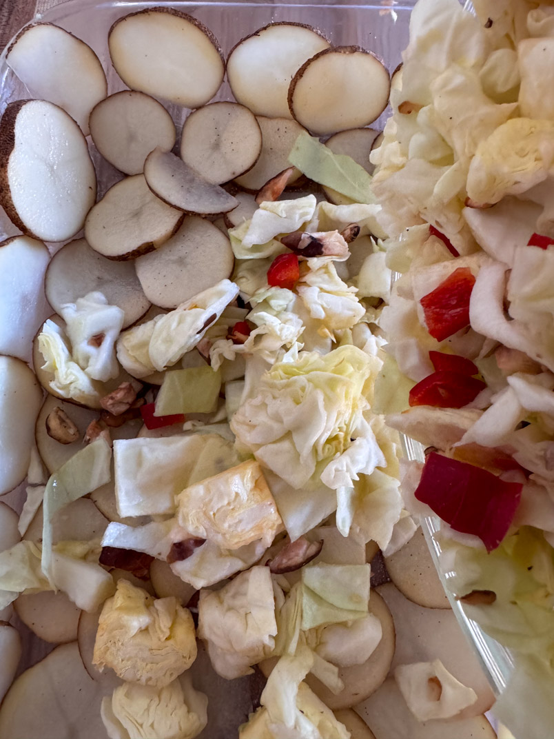 layered potatoes, cabbage, mushrooms, and peppers