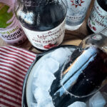 homemade healthy drink with cherry pomegranate juice, coconut water, and mineral water